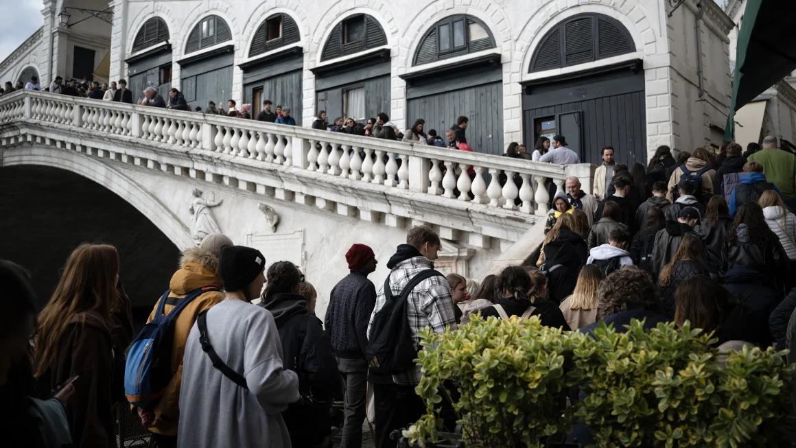 Venice faces a continual onslaught of tourists as its population declines. Marco Bertorello/AFP/Getty Images