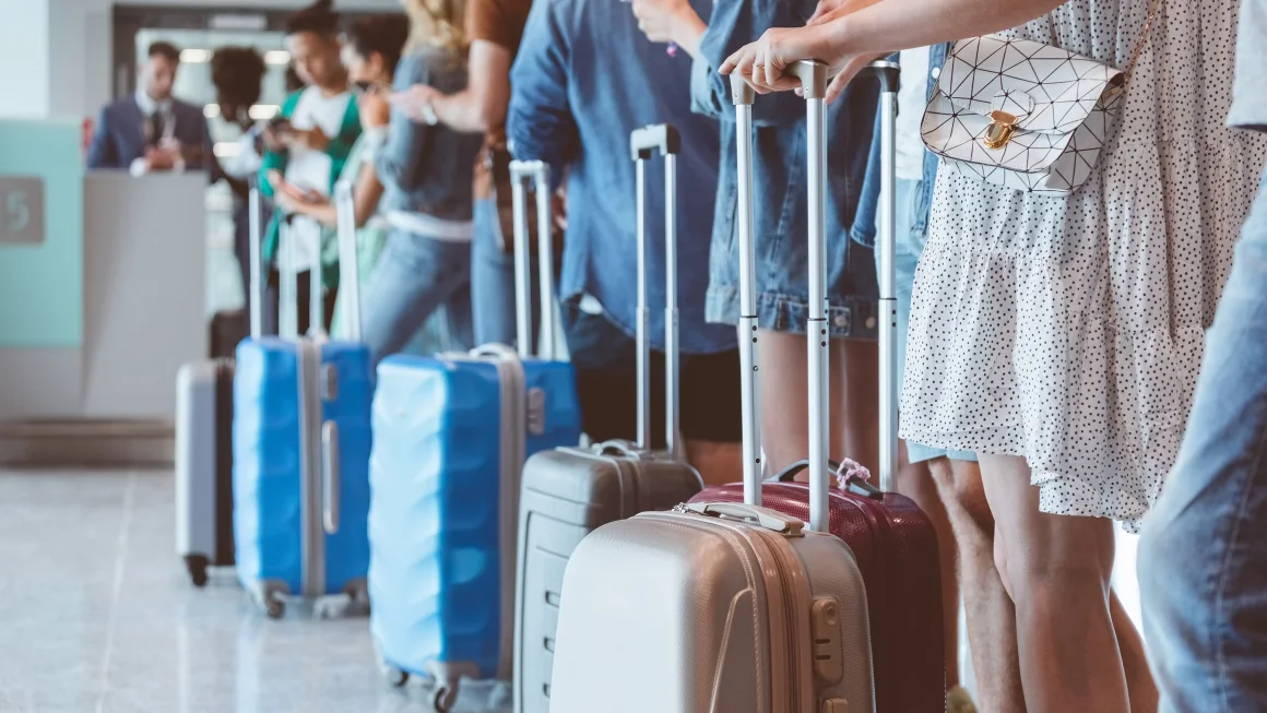 Flyers wait in line for boarding. At select airports, people who attempt to board too early could be beeped. izusek/E+/Getty Images